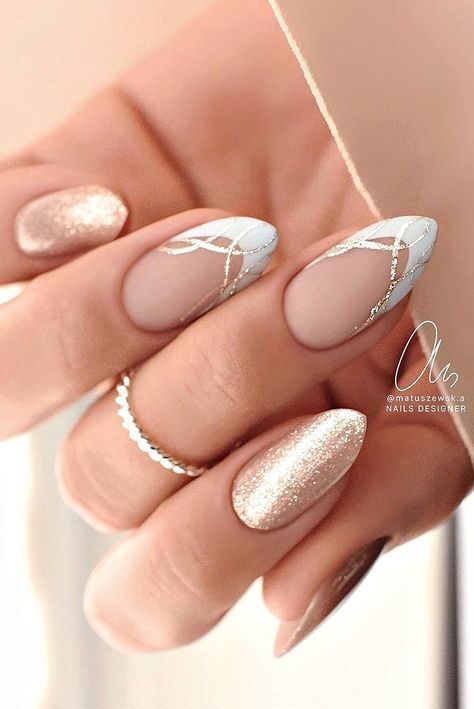 Rose gold glitter nails paired with white and silver geometric French tips.