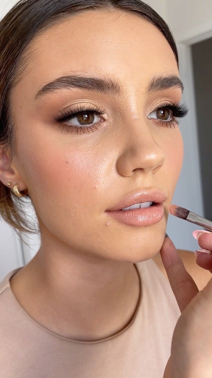 Honey champagne shadow with smoky outer corners and glossy nude lips. 