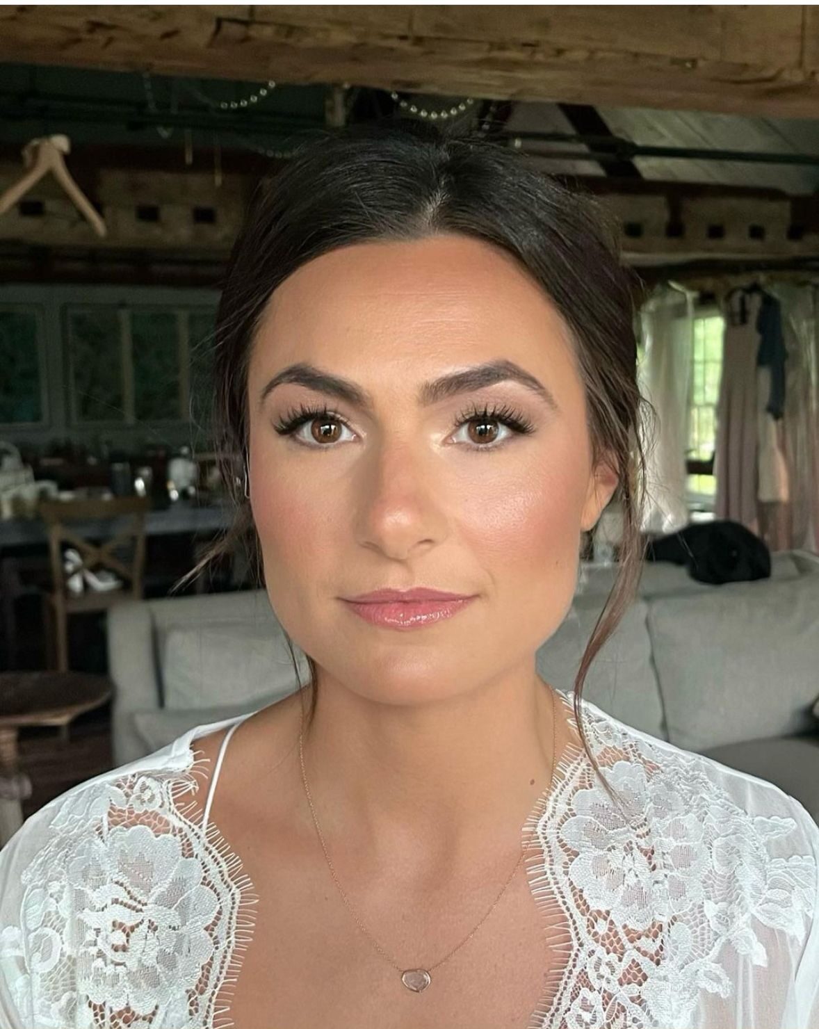 Understated smooth vanilla shadow look with clean smudged lash lines.
