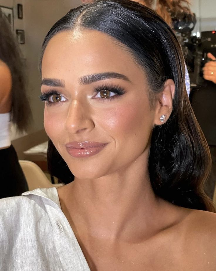 Sultry bridal look featuring smoky espresso shadow and glossy berry lips.
