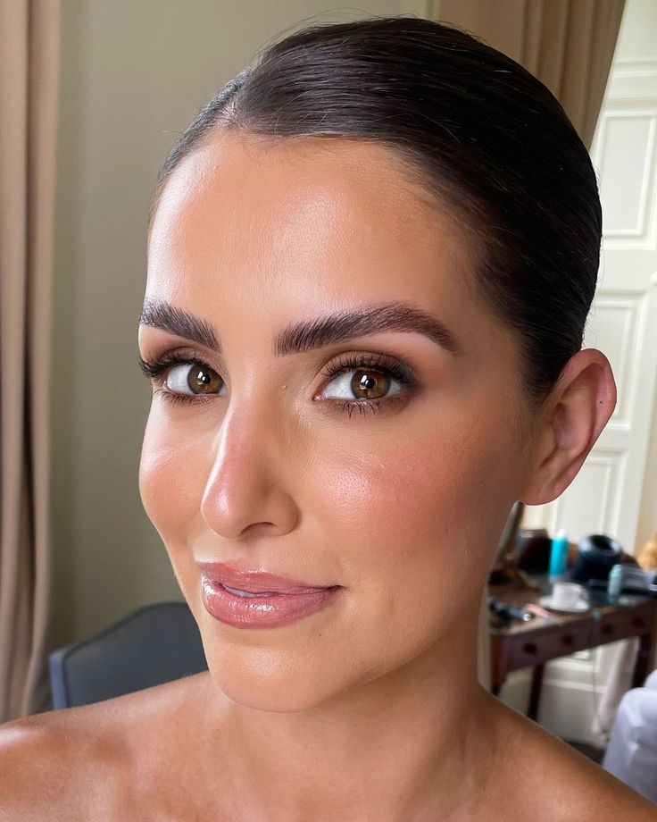 Framed eye look with defined upper and lower lash lines on deep brown eyes.