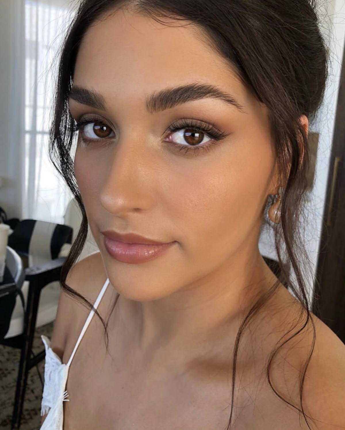 Soft chocolate and taupe smoky eye paired with a satin nude lip. 
