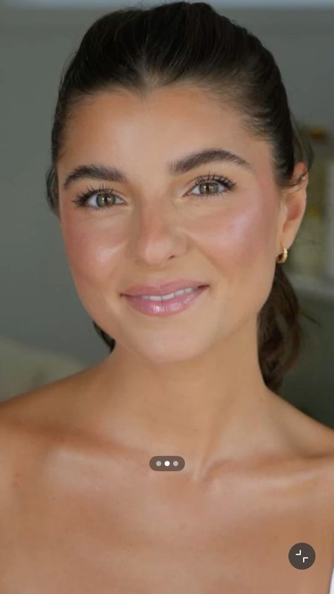 Barely there dewy skin texture using a liquid illuminator and clear pink lip balm.