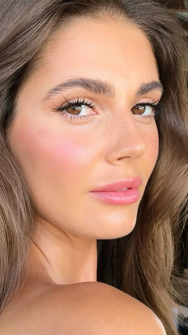 Ultra-luminous peach base with glossy peach lips and bright, reflective peach blush.
