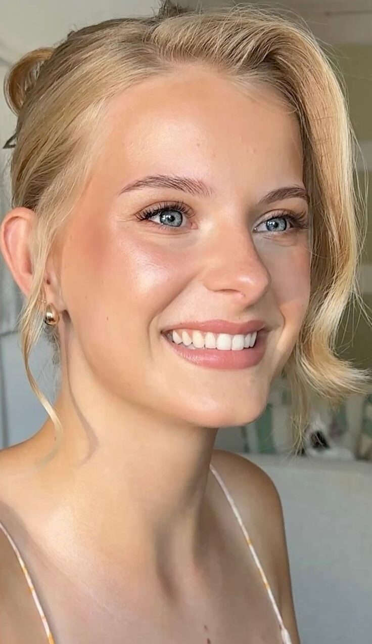 Soft structure using cream contour and highlight with a muted rose lipstick.