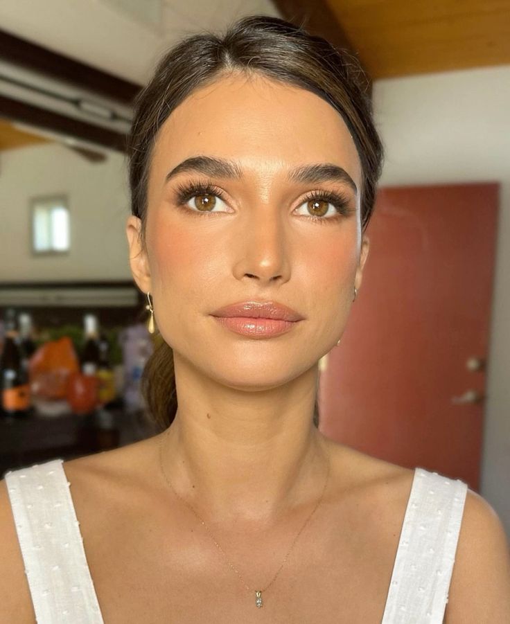 Warm golden brown shadows and structured feathery brows on a dark-haired bride.